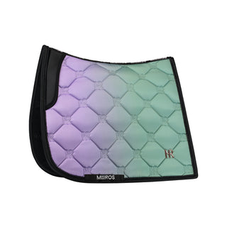 A multicolored geometric patterned dressage saddle pad in shades of purple and green with double rope pipping and a golden cutout diamond metal logo.